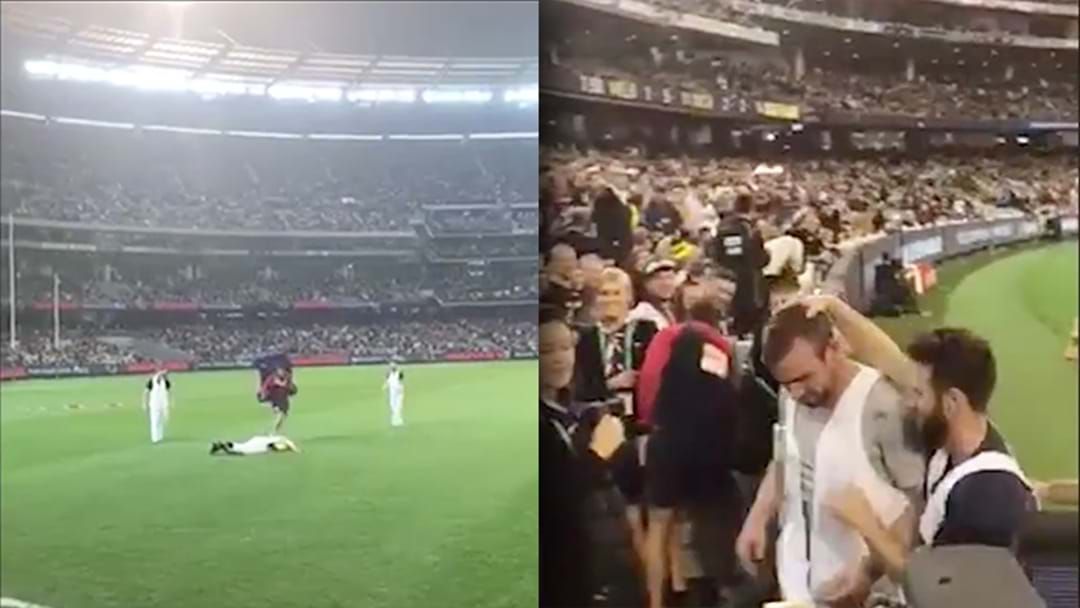 Article heading image for WATCH | Footy Fan Completely Stacks It During Quarter Time Marking Contest