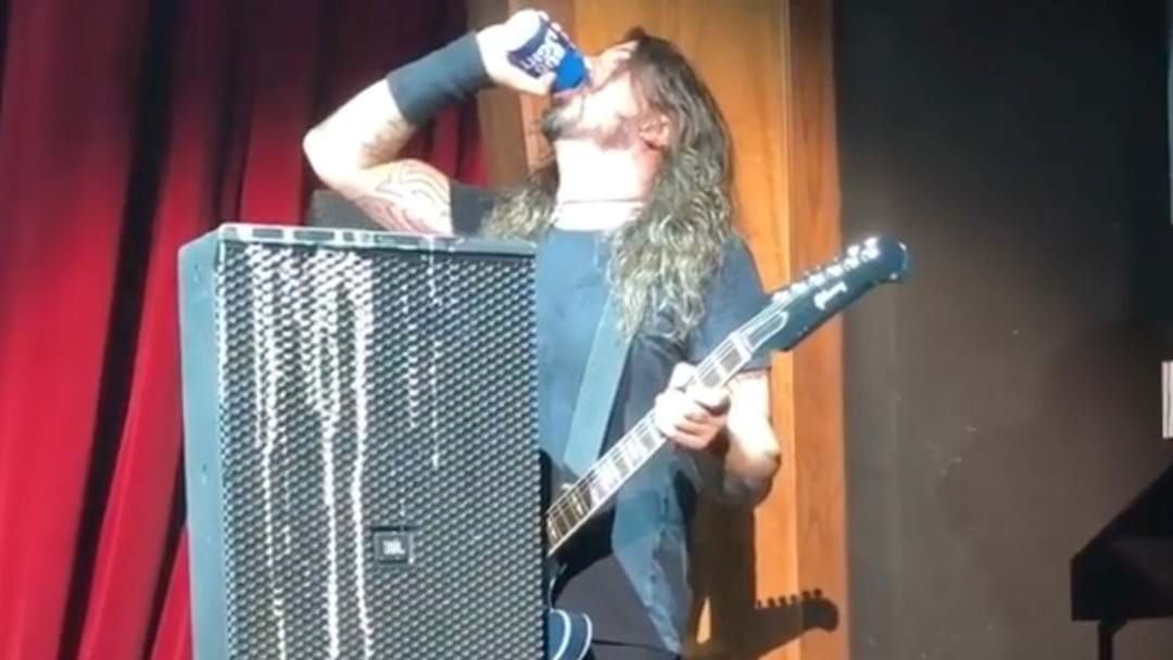 Article heading image for Dave Grohl Chugs A Beer, Then Falls Off The Stage... Again