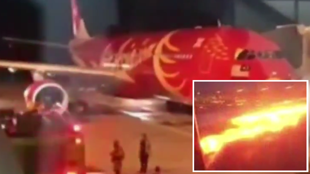 Article heading image for Air Asia Flight Makes Emergency Landing After Passengers See Sparks Coming From Engine 
