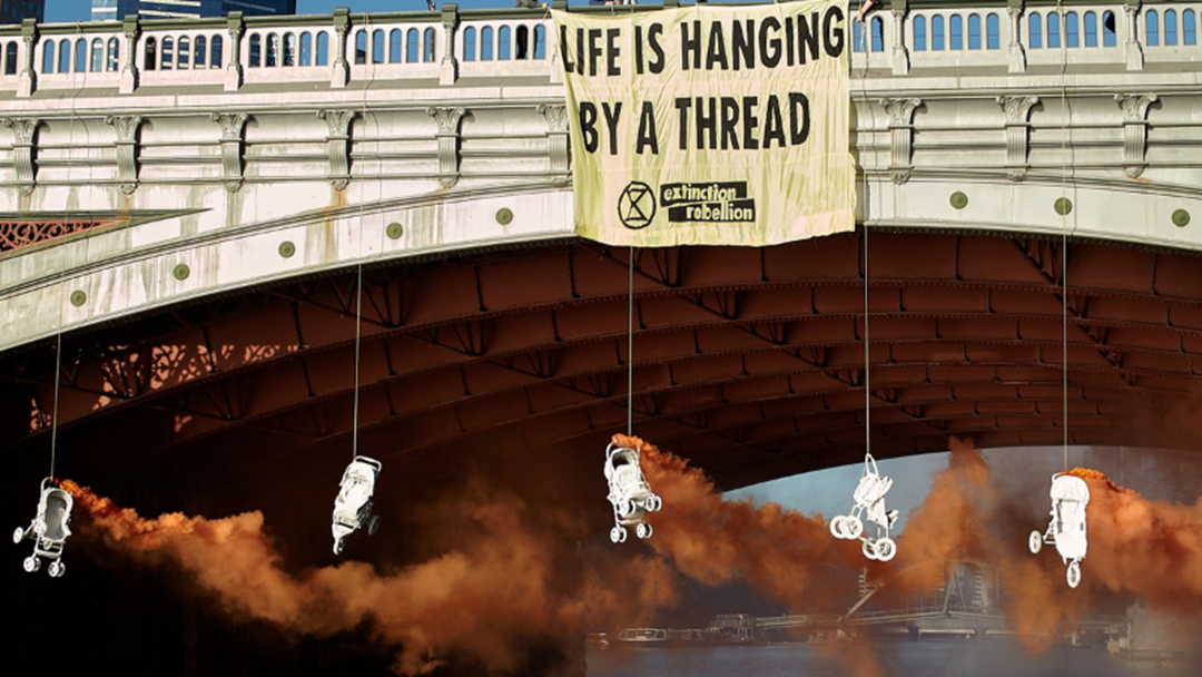 Article heading image for Climate Protestors Cause Chaos As They Glue Themselves To Princes Bridge