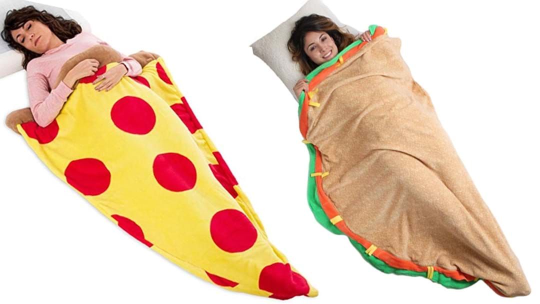 Article heading image for Taco & Pizza Sleeping Bag Blankets Exist So You Can Look Like A Snack 24/7