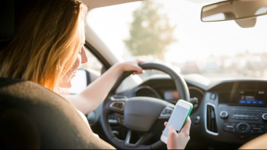 Article heading image for Heads Up WA, Touching Your Phone In The Car Will Now Get You A $1000 Fine 
