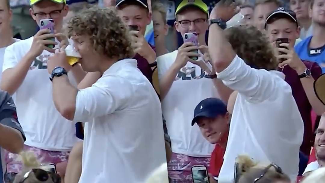 Article heading image for Watch: Nick 'Honey Badger' Cummins Skulls Beer In 2 Seconds At Brisbane Rugby Event