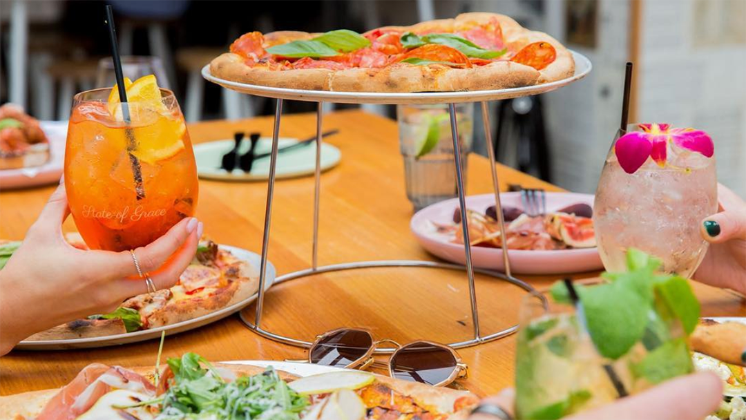 Article heading image for This Melbourne Bar Is Doing $25 Bottomless Pizza w/ A Spritz On Arrival