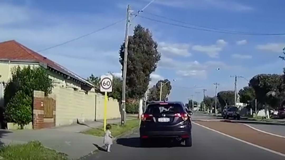Article heading image for Dashcam Footage Shows Horrifying Moment Toddler Wanders Onto The Road