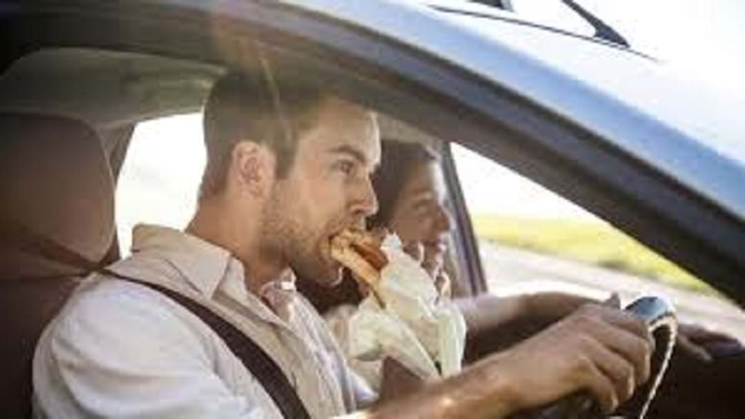 Article heading image for Can you be fined for eating while driving?