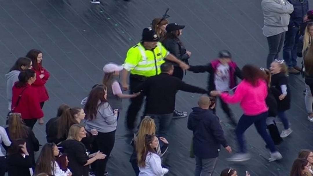 Article heading image for Legend Police Officer Dances With Kids At Manchester One Love Concert