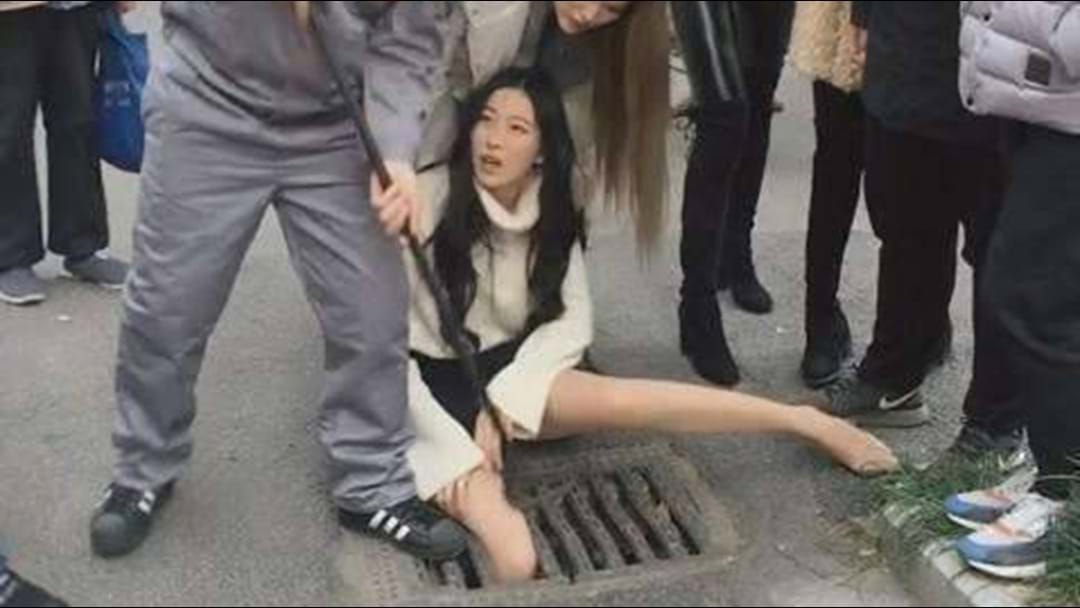 Article heading image for Woman Becomes Trapped In Grate After Texting While Walking