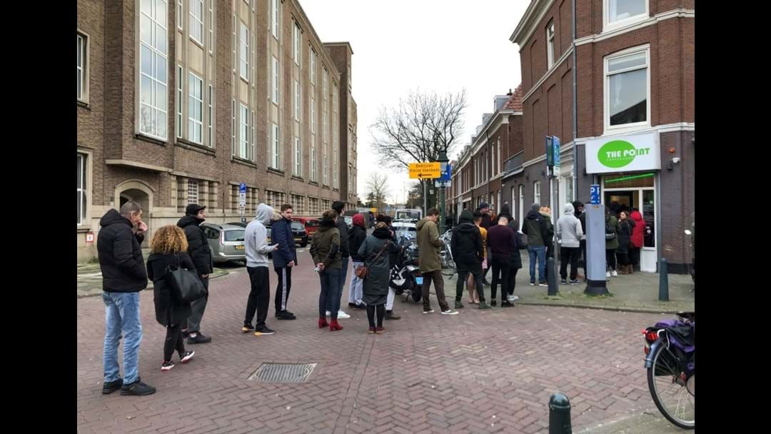 Article heading image for In Amsterdam People Are Queueing Down The Street For Weed. Meantime Americans Are Doing The Same For Guns
