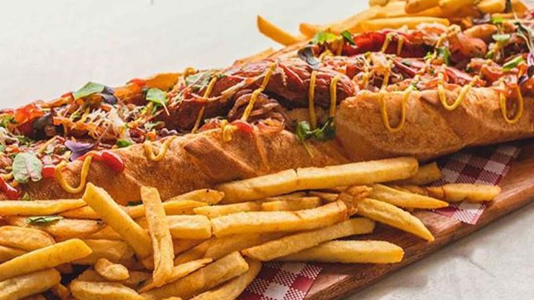 Article heading image for A Two-Foot-Long Hotdog Is Here To Challenge Your Stomach