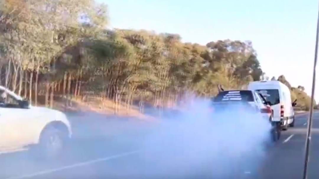 Article heading image for Driver Filmed Doing Burnouts While Being Towed On Freeway