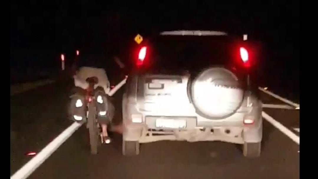 Article heading image for Cyclist Captured Holding onto Car in Woolgoolga 