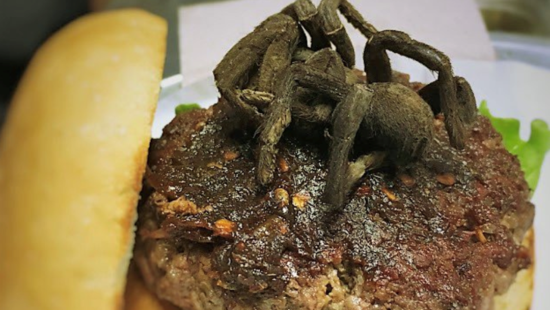 Article heading image for The Burger Joint Topping Their Burgers With Lightly Salted, Oven Baked Tarantulas