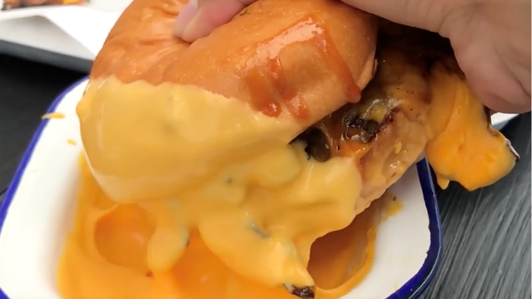 Article heading image for This Sydney Burger Joint Lets You Dip Your Burg In A Bowl Of Melted Cheese